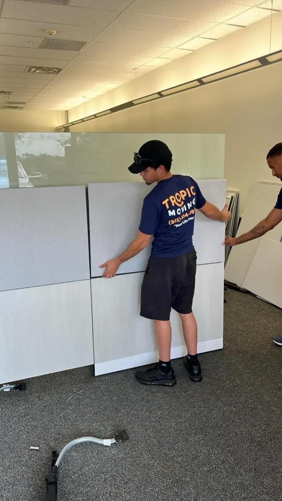 Tropic crew member protecting furniture for commercial delivery